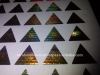 Triangle shape hologram labels.